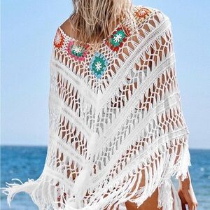 Boho-style white crochet poncho cover-up with flower details